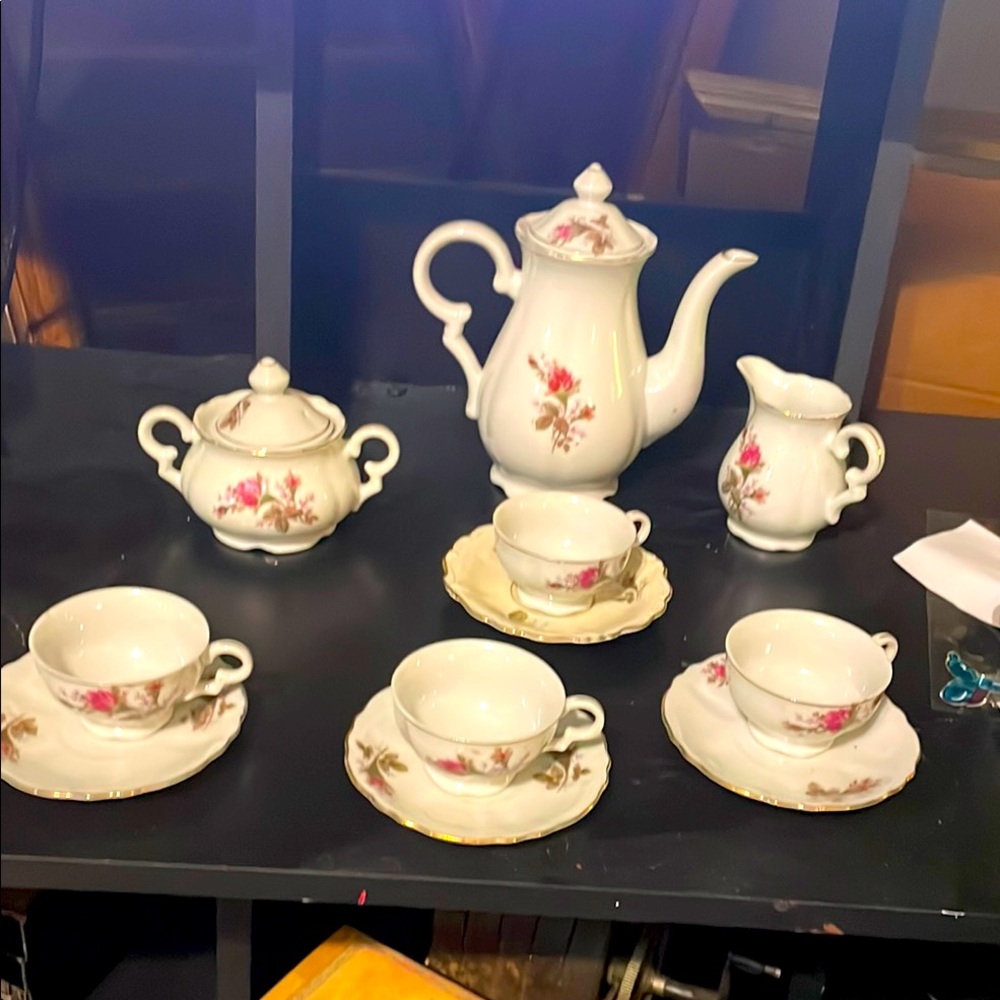 15 piece Floral White Tea Set. Never saw a drop of beverage.